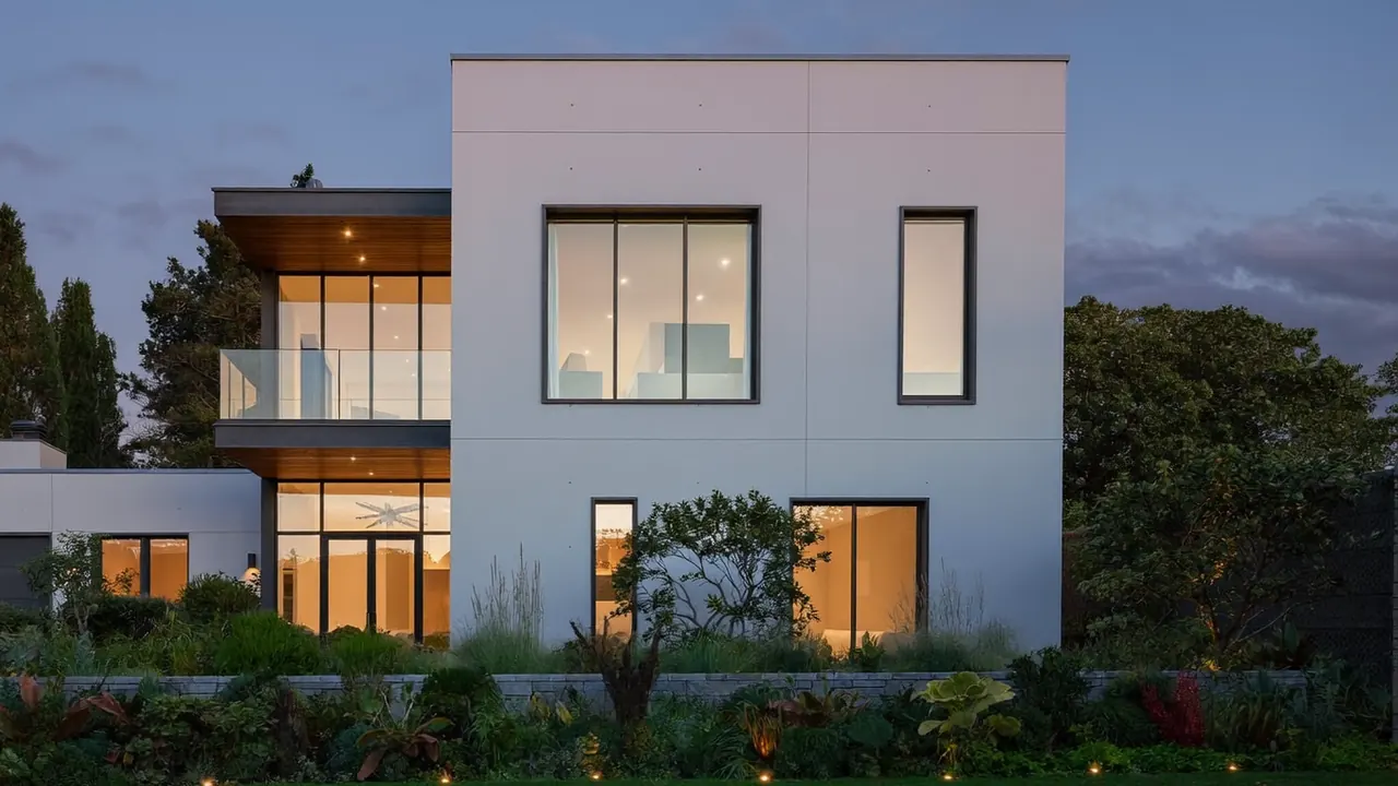 Row of newly fitted double glazed windows on a brick terrace facade at dusk
